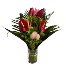 Tropical Bouquet with glass vase (1) Ginger Pink, (3) Ginger Red, (2) Anthurios, (2) Hel. Sassy, (2) Eucaliptos doll, (3) Lettuce Fern, (2) Palma Flecha, (2) Diafembancha, (2) Croto Pecoso, (1) Tip Bronce, (6) Codelines. 
